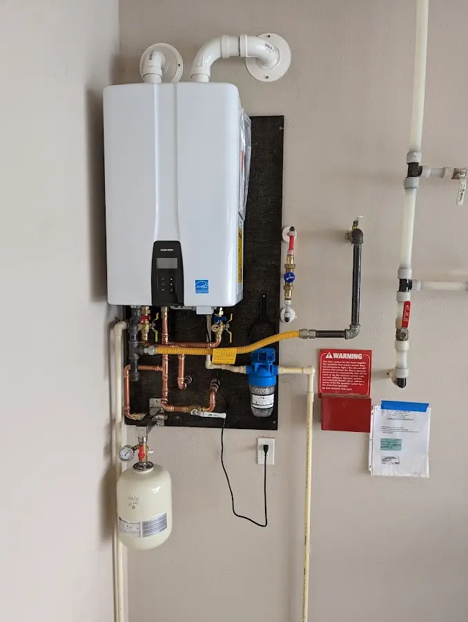 Professional plumber installing copper piping in a Spring Valley home